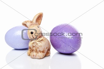Cute little Easter bunny with two colourful Easter eggs