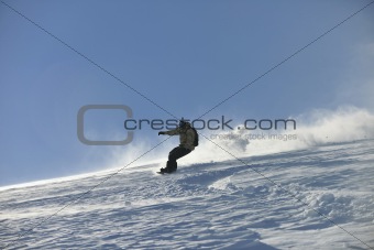 freestyle snowboarder jump and ride