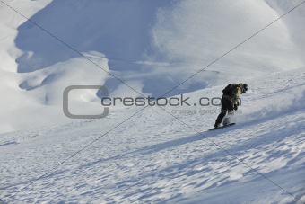 freestyle snowboarder jump and ride