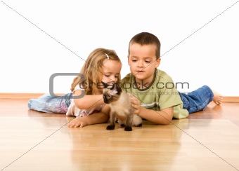 Kids playing with their new kitten