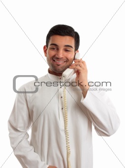 Middle eastern arab man using the telephone