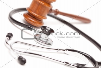 Black Stethoscope and Gavel Isolated on a White Background.