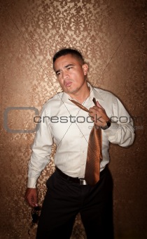 Hispanic Man Tugging at His Tie
