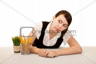 Bored female office worker at her desk