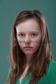 studio portrait of a pretty, eleven years old girl