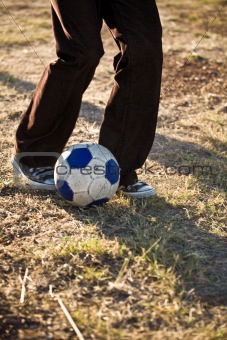 Boy kicking soccer boy