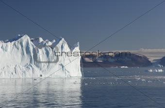 Iceberg with waterfall in Greenland
