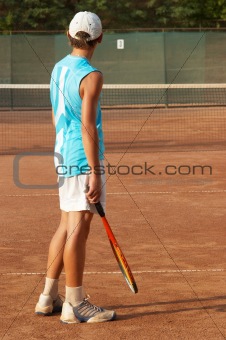 boy on tennis court