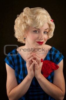 Pretty retro blonde woman in vintage 50s dress