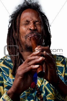Rastafarian playing the flute