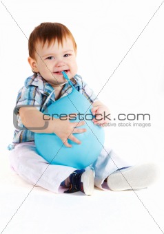 Little boy eats blue baloon
