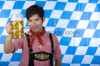 Smiling Asian holding Oktoberfest beer stein (Mass)