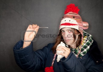 Pretty young woman with either flu or cold