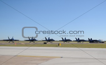 Navy jets parked on the ground