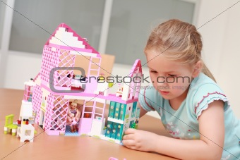 Playing with doll's house