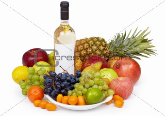 Still life - tropical fruits and bottle of wine