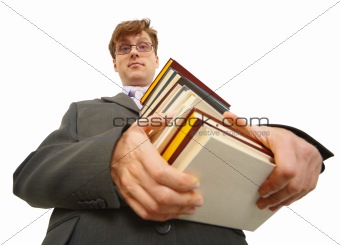 Young man with pile of books in hands