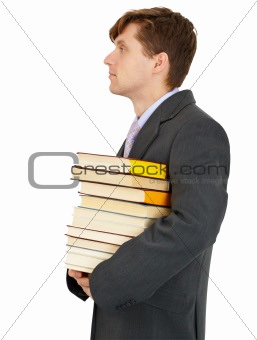 Young man has stack of library books