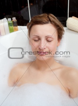 Beautiful woman relaxing in a bubble bath