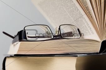 books and eyeglasses