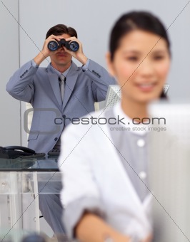 Visionary businessman using binoculars 