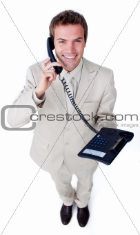Smiling businessman talking on phone 