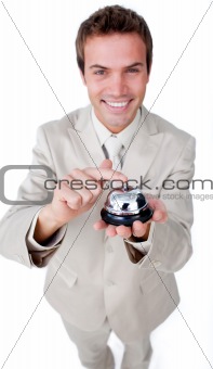 Smiling businessman using a service bell 
