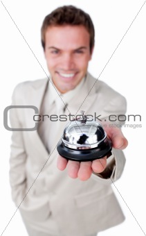 Attractive businessman showing a service bell 