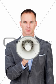 Serious businessman holding a megaphone 