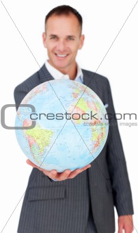 Cheerful businessman holding a terreatrial globe 