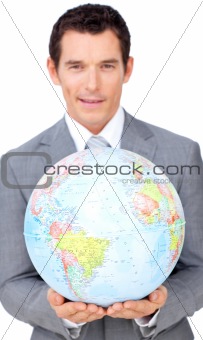 Assertive businessman holding a terrestrial globe 