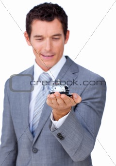 Attractive caucasian businessman showing a service bell 