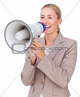 Attractive businesswoman shouting through a megaphone 