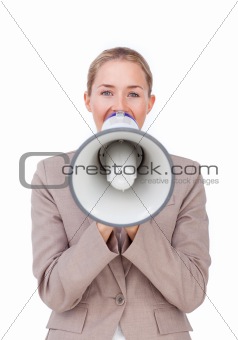 Young businesswoman giving instructions with a megaphone