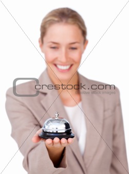 Attractive businesswoman holding a service bell