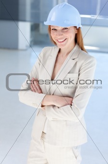 Attractive female architect wearing a hard hat