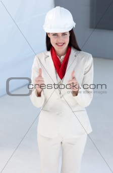 Beautiful female architect wearing a hard hat