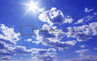 The shining sun on the blue sky