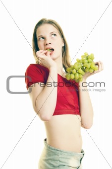 young woman eating grapes