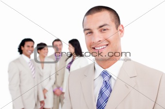 Happy businessman standing in front of his team 