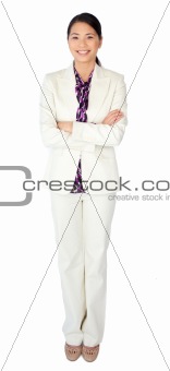 Portrait of a young businesswoman standing with folded arms 