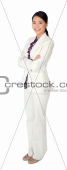 Attractive asian businesswoman standing with folded arms