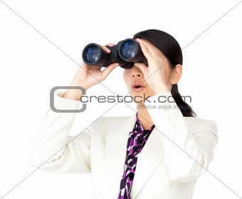 Surprised businesswoman looking through binoculars