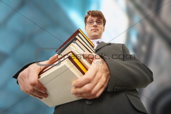 Librarian holding pile of books