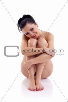 woman embracing her legs