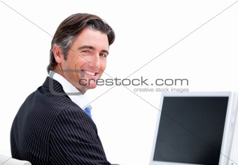 Handsome businessman working at a computer 