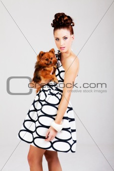 Young Woman Holding Dog