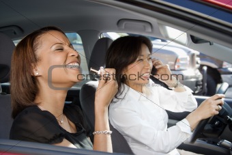 Laughing women in car.