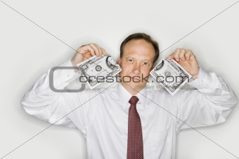 Businessman ripping money