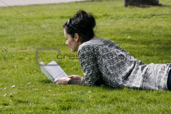 young woman reading book 